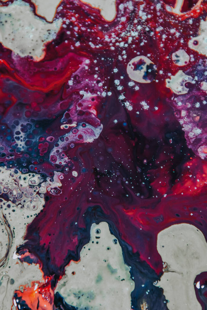A vertical shot of an abstract painting with mixed oil paint colors - perfect for wallpaper - 写真・画像