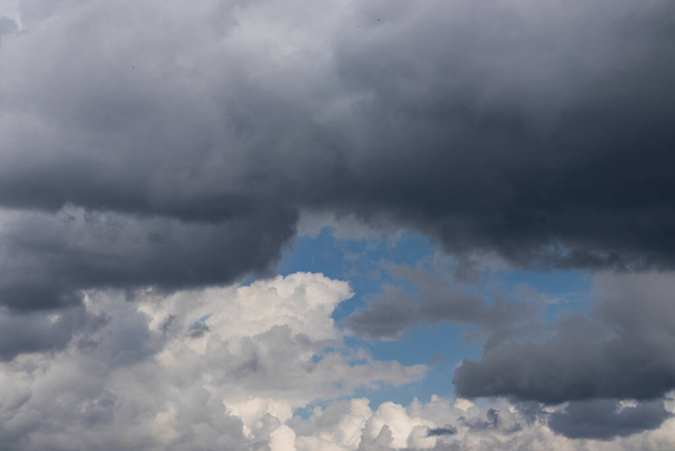 A beautiful view of thick, dark rain clouds in the sky - Valokuva, kuva