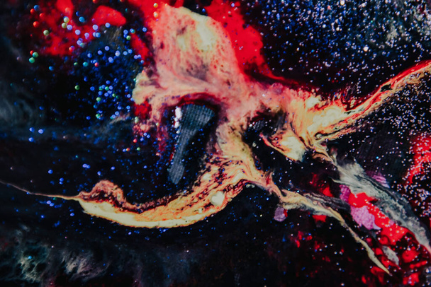 A closeup shot of multicolor acrylic paint on canvas, abstract art background - Fotó, kép