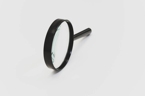 A closeup of a magnifier isolated on a white background - Valokuva, kuva