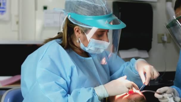 Dentist using thread to a patient. Prophylaxis concept. - Video, Çekim