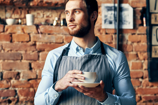 male waiter apron coffee cup work professional cafe - Фото, изображение