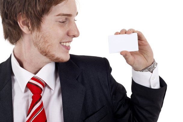Smiling business man presenting a white business card - Photo, Image