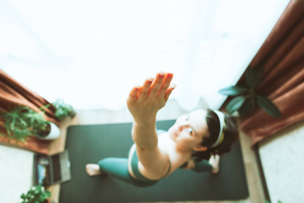woman do yoga at home near big window healthy lifestyle - Foto, Imagem