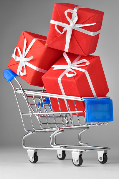 Closeup of a shopping cart with gifts - 写真・画像
