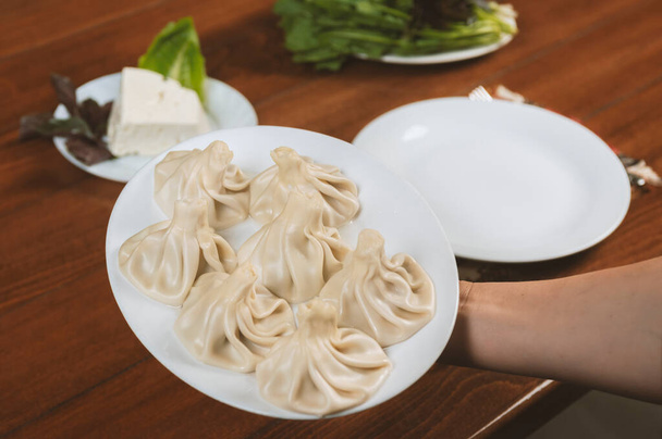 A dish of khinkali, a traditional georgian dumpling with minced meat - 写真・画像