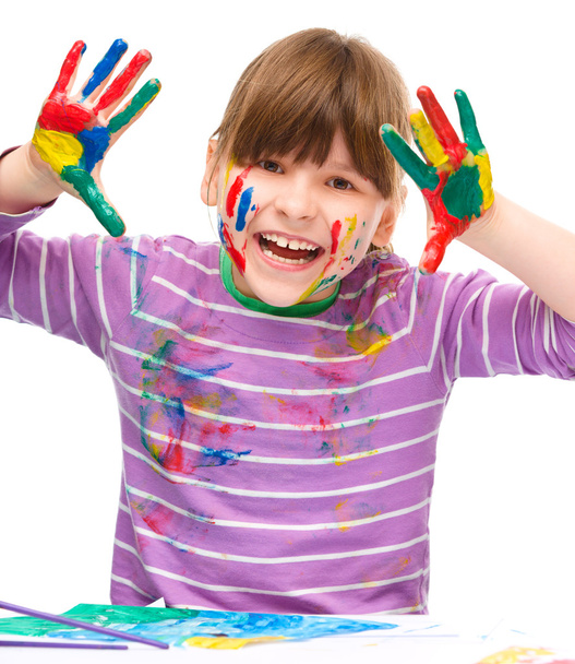 Portrait of a cute girl playing with paints - Фото, изображение