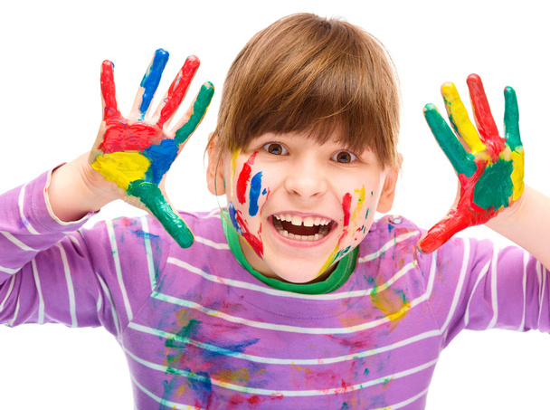 Portrait of a cute girl playing with paints - Foto, Imagem