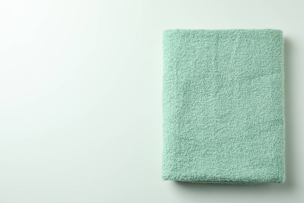 Clean green folded towel on white background - Photo, Image