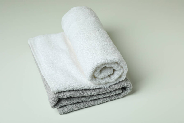Clean folded towels on white background, close up - Foto, afbeelding