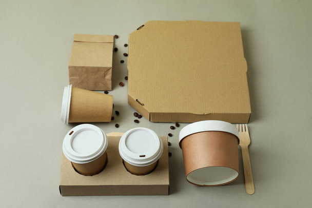Delivery containers for takeaway food on gray background - Foto, Imagen