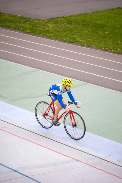 Kyiv, Ukraine - 2021 May 15: Training in the discipline of Keirin(track cycling race) on the Kyiv Cycle Track under the guidance of coach, multiple champion of Ukraine and the USSR Eugene Prysyazhenko - Fotó, kép