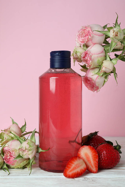 Natural shower gel and ingredients against pink background - Φωτογραφία, εικόνα