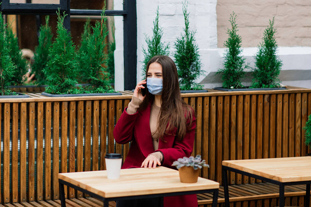 Young woman with face mask in restaurant, New normal concept for protect coronavirus pandemic - Foto, immagini