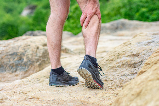 male runner suffering with pain on sports running knee injury - Valokuva, kuva