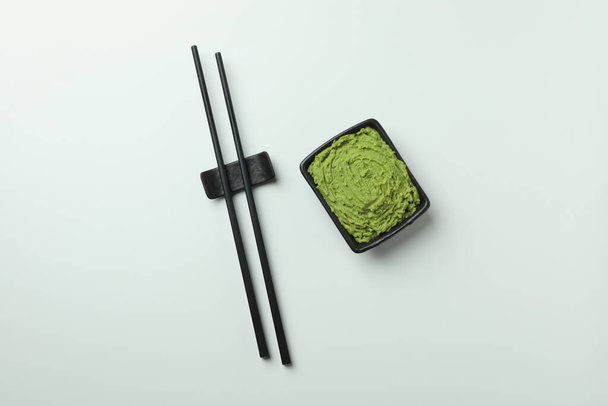 Chopsticks and wasabi sauce on white background - Zdjęcie, obraz