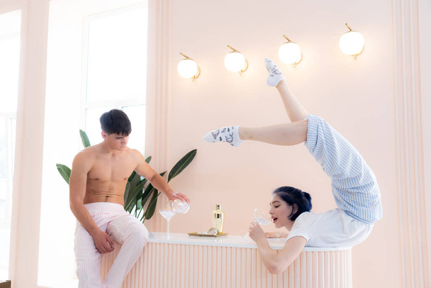 man and woman drinking and doing romantic party for two at home.Date, relationship, chill concept.  - 写真・画像