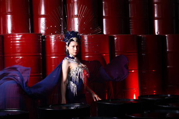 High Fashion Asian Model Woman wear Haute Counture Gown with make up for new trend season. SuperModel be shoot fashion photography in Red Barrel Steel Factory, copy space - Photo, Image