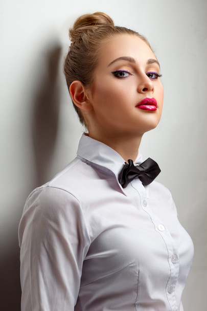 blondie woman in white shirt and black bow-tie - Photo, Image