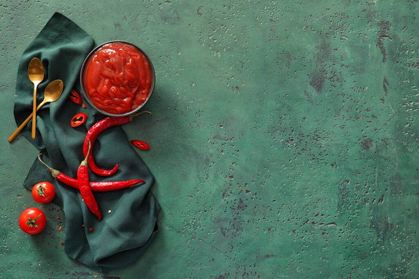 Composition with tasty chili sauce and ingredients on color background - Photo, Image