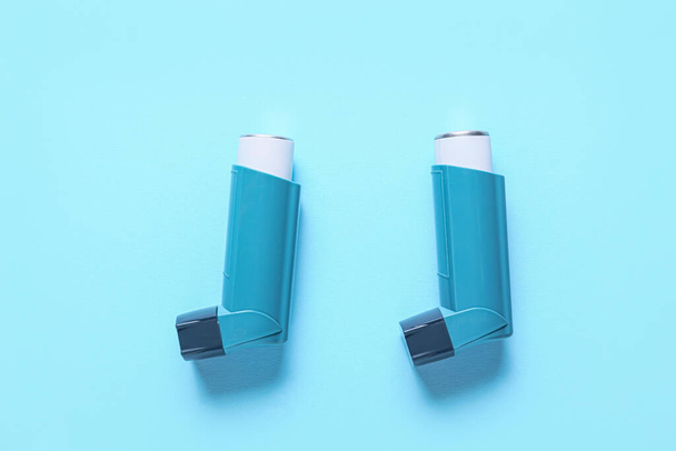 Modern inhalers on color background - Photo, Image