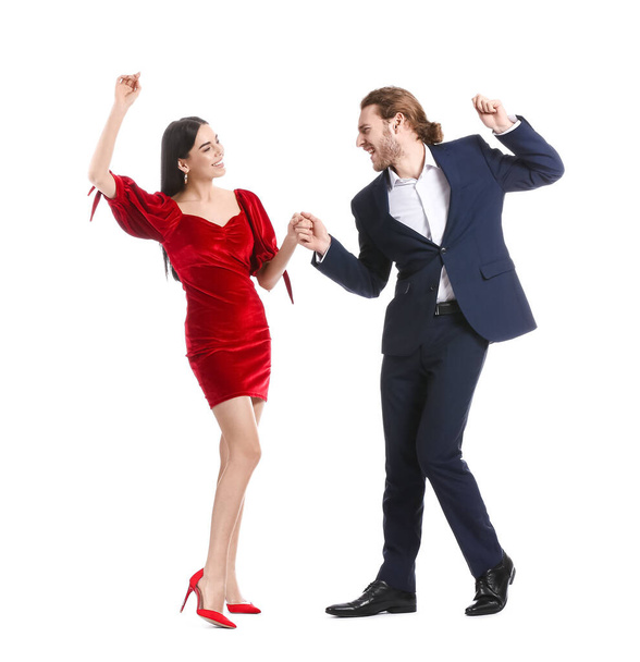 Happy young couple dancing on white background - Photo, Image
