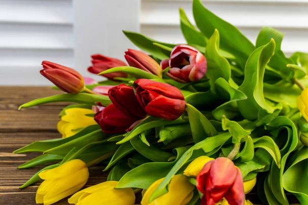 Bouquet of Spring Flowers - Red and Yellow Tulips - Foto, Bild