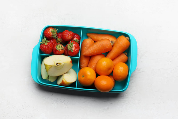 Lunchbox with tasty food on light background - Fotografie, Obrázek