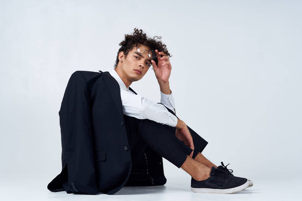 curly haired man in classic suit model studio photography sneakers - Фото, зображення