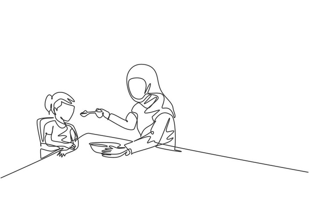 Single continuous line drawing of young Islamic mom feeding healthy food to daughter at breakfast time. Arabian muslim happy family motherhood concept. Trendy one line draw design vector illustration - Vector, Image