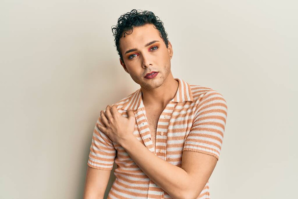 Handsome man wearing make up wearing casual shirt pointing with finger to the camera and to you, confident gesture looking serious  - Foto, immagini
