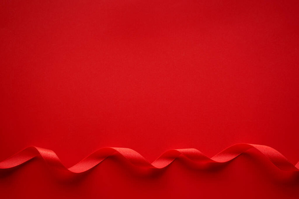 wavy ribbon on red background - Фото, изображение