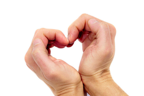 Manos de hombre formando un corazón sobre un fondo blanco
 - Foto, Imagen