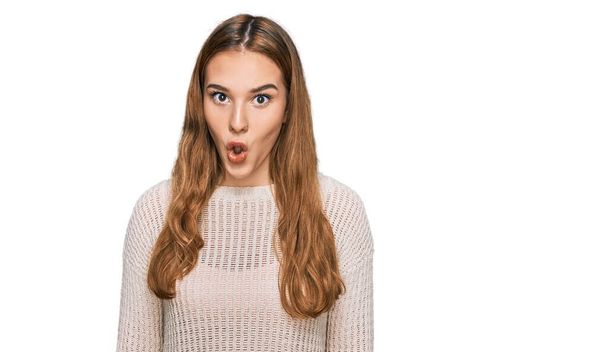 Young blonde woman wearing casual clothes afraid and shocked with surprise expression, fear and excited face.  - Photo, Image