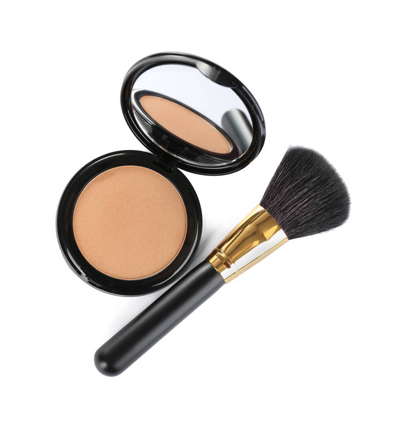 Face powder with brush on white background, top view. Makeup product - Photo, Image