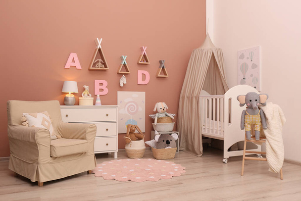 Baby room interior with stylish furniture and comfortable crib - Photo, image