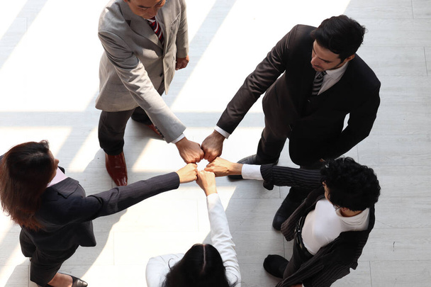 Overhead view of business man and woman putting hands first join together, business partnership collega 's holding hands as commitment of strong team work, unity and teamwork Join hands support concept.  - Foto, afbeelding