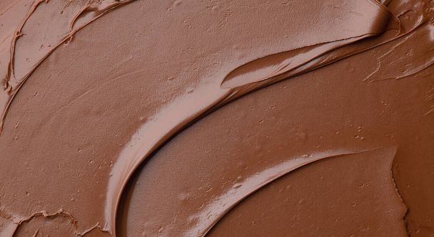 плавленый шоколадный крем фон, вид сверху  - Фото, изображение