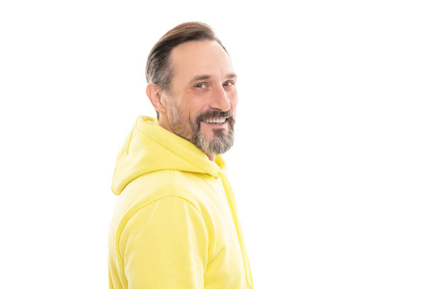 smiling handsome mature man with beard and moustache in hoody isolated on white, grizzled hair - Photo, Image