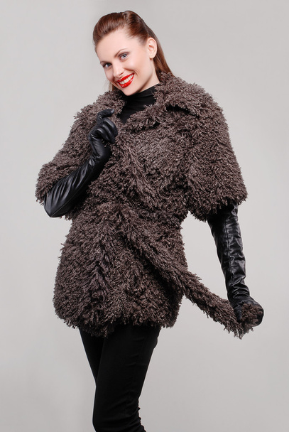 Beautiful woman in fur coat - Фото, зображення