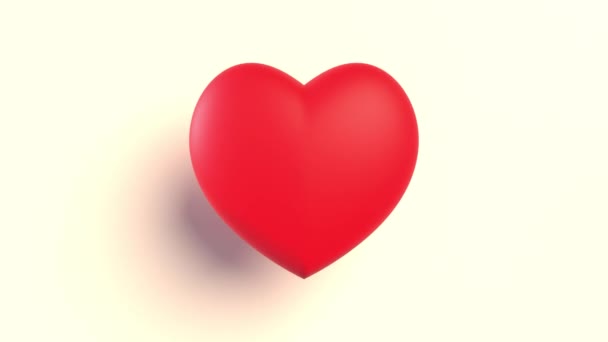 Latiendo corazón de juguete rojo sobre un fondo claro - Imágenes, Vídeo