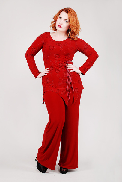 Attractive young redhead woman in stylish clothes - Фото, зображення