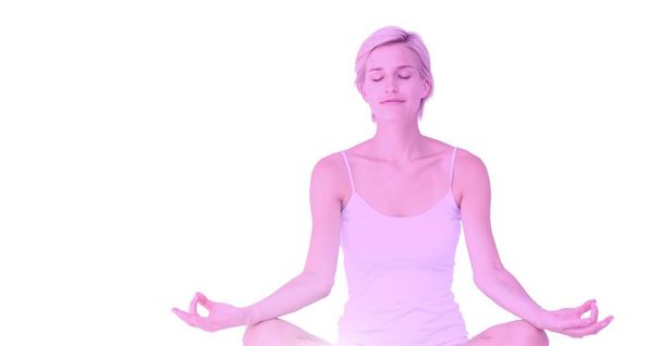 Caucasian fit woman with eyes closed practicing yoga on white background. healthy lifestyle, wellbeing and fitness concept digitally generated image. - Φωτογραφία, εικόνα