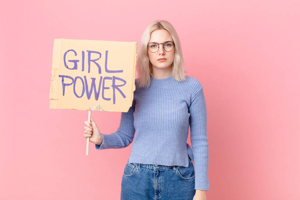 blond woman with a girl power banner - Zdjęcie, obraz