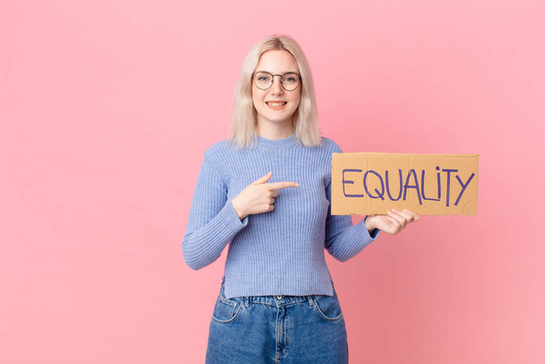 blond woman with a equality concept banner - Foto, imagen