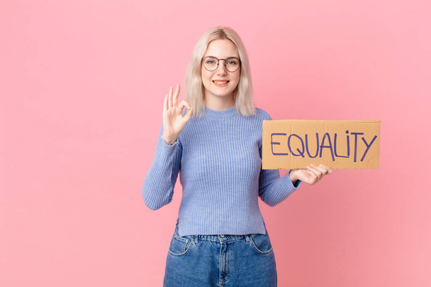 blond woman with a equality concept banner - Fotoğraf, Görsel