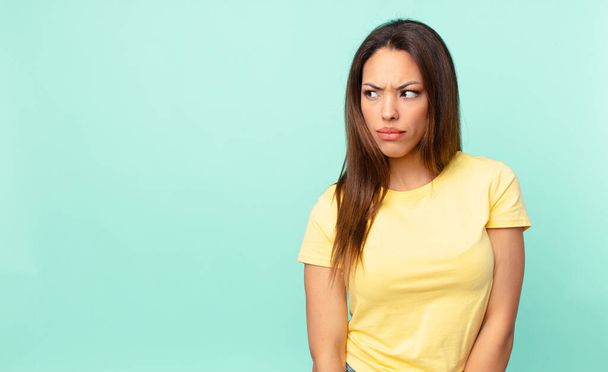 young hispanic woman feeling sad, upset or angry and looking to the side - Photo, Image