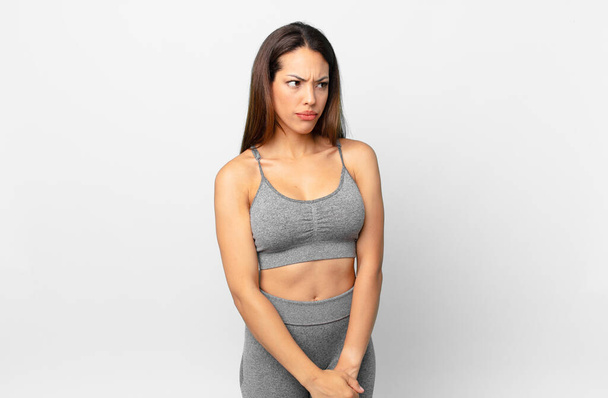 young hispanic woman feeling sad, upset or angry and looking to the side. fitness concept - Valokuva, kuva