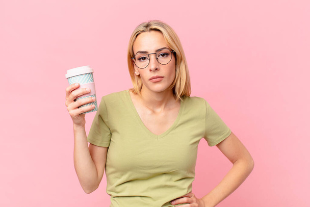 blond pretty woman having a coffee - Фото, зображення