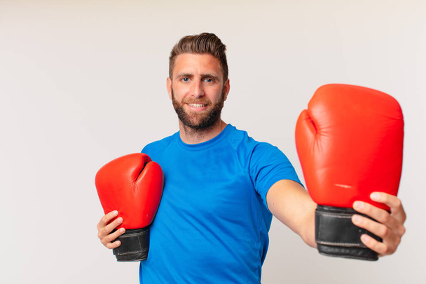 young fitness man with a boxing gloves - Fotografie, Obrázek